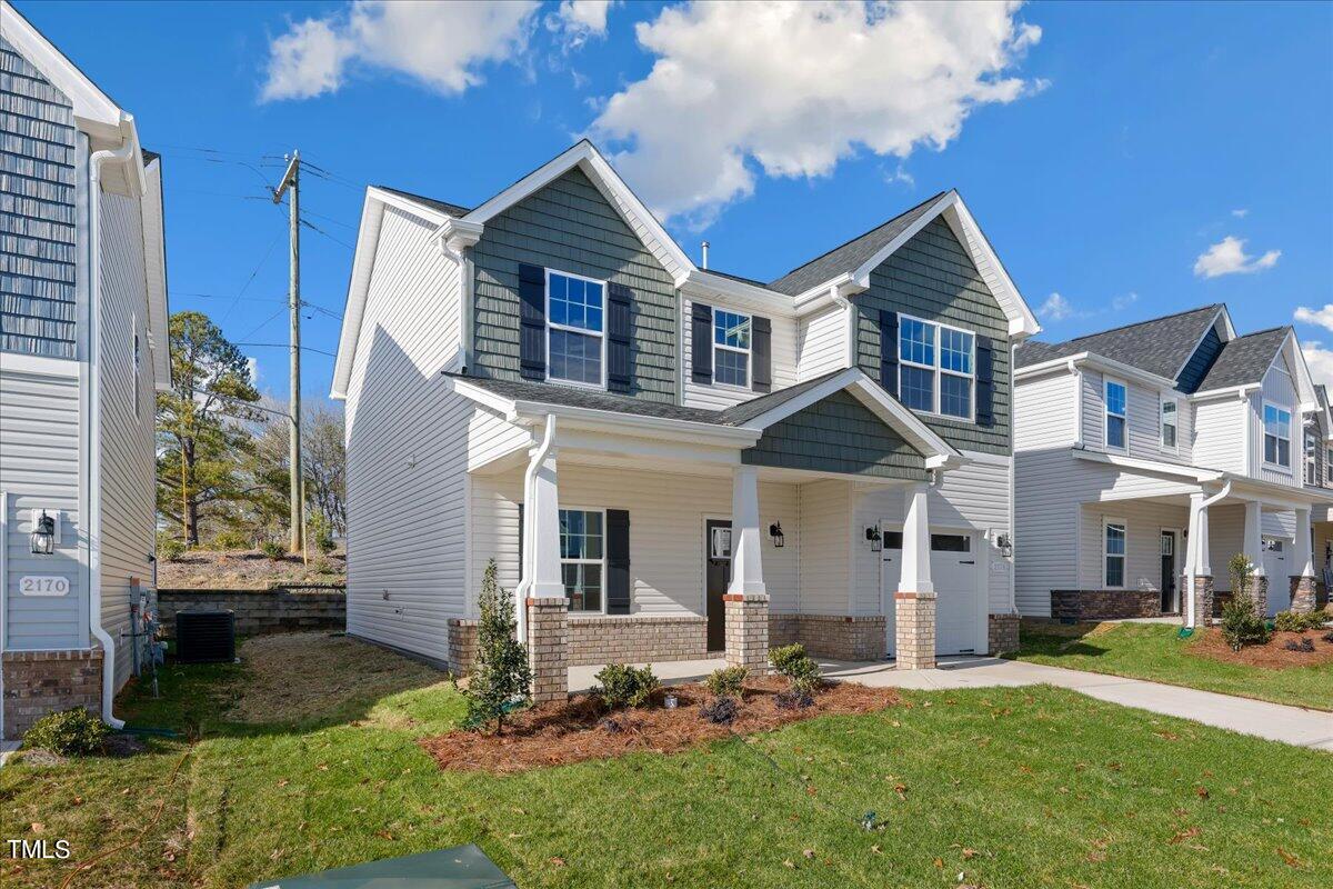 2178 Campbell Loop Burlington, NC 27215 - Photo 3 of 30 a front view of a house with a yard