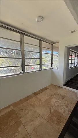 a view of an empty room and window