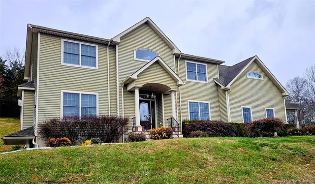 a front view of a house with a yard