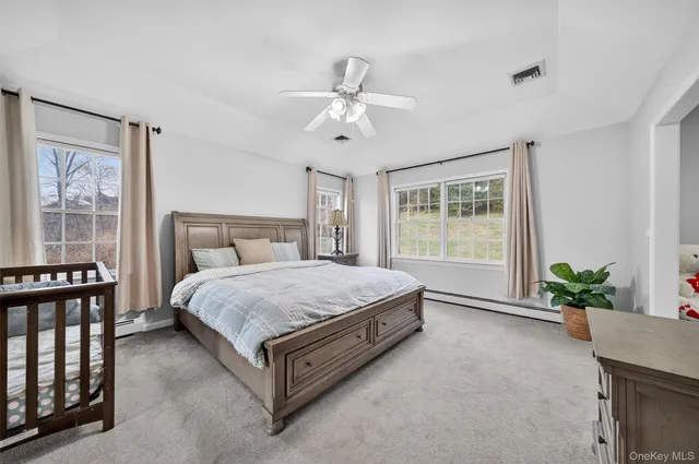 a bed room with a bed and a chandelier