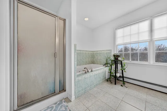 a livingroom with workspace fireplace and dining area