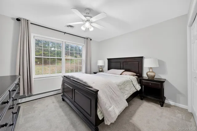 a spacious bathroom with a double vanity sink and a mirror
