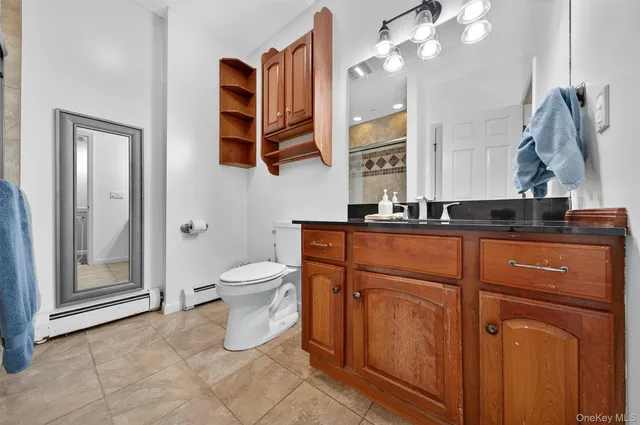 a spacious bedroom with a bed and window