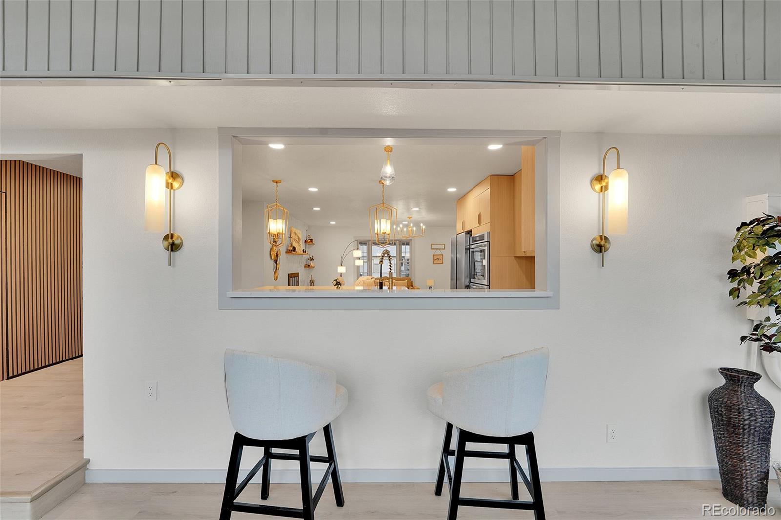 830 Welch Street Golden, CO 80401 - Photo 12 of 37 a view of a hallway with furniture and a potted plant