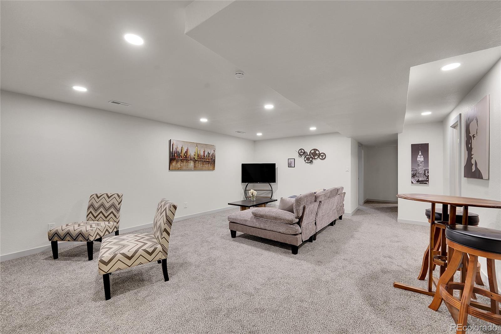 830 Welch Street Golden, CO 80401 - Photo 19 of 37 a living room with furniture and a wooden floor