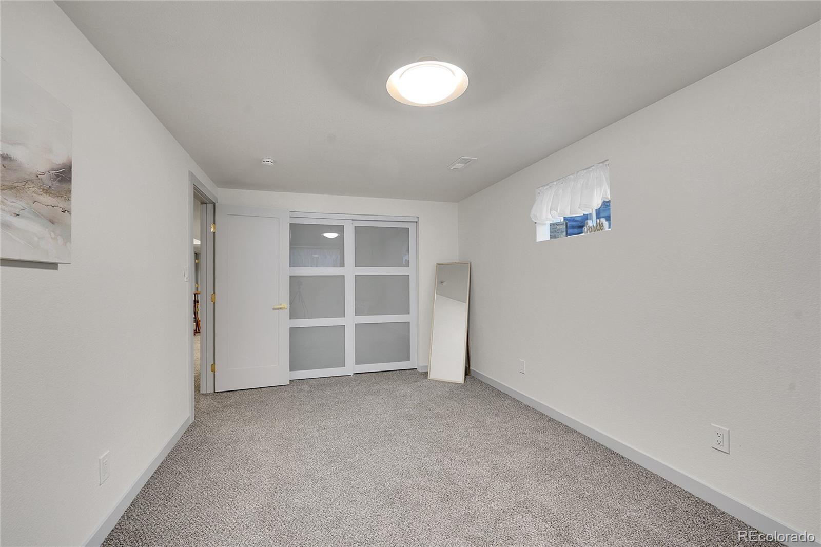 830 Welch Street Golden, CO 80401 - Photo 27 of 37 an empty room with a empty space and window