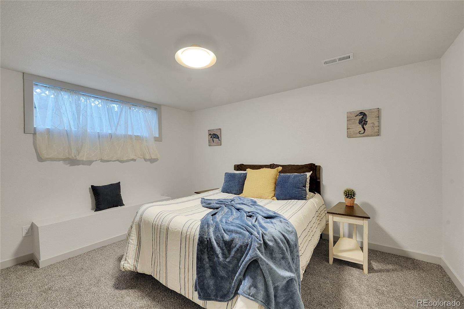 830 Welch Street Golden, CO 80401 - Photo 28 of 37 a bedroom with a bed and window