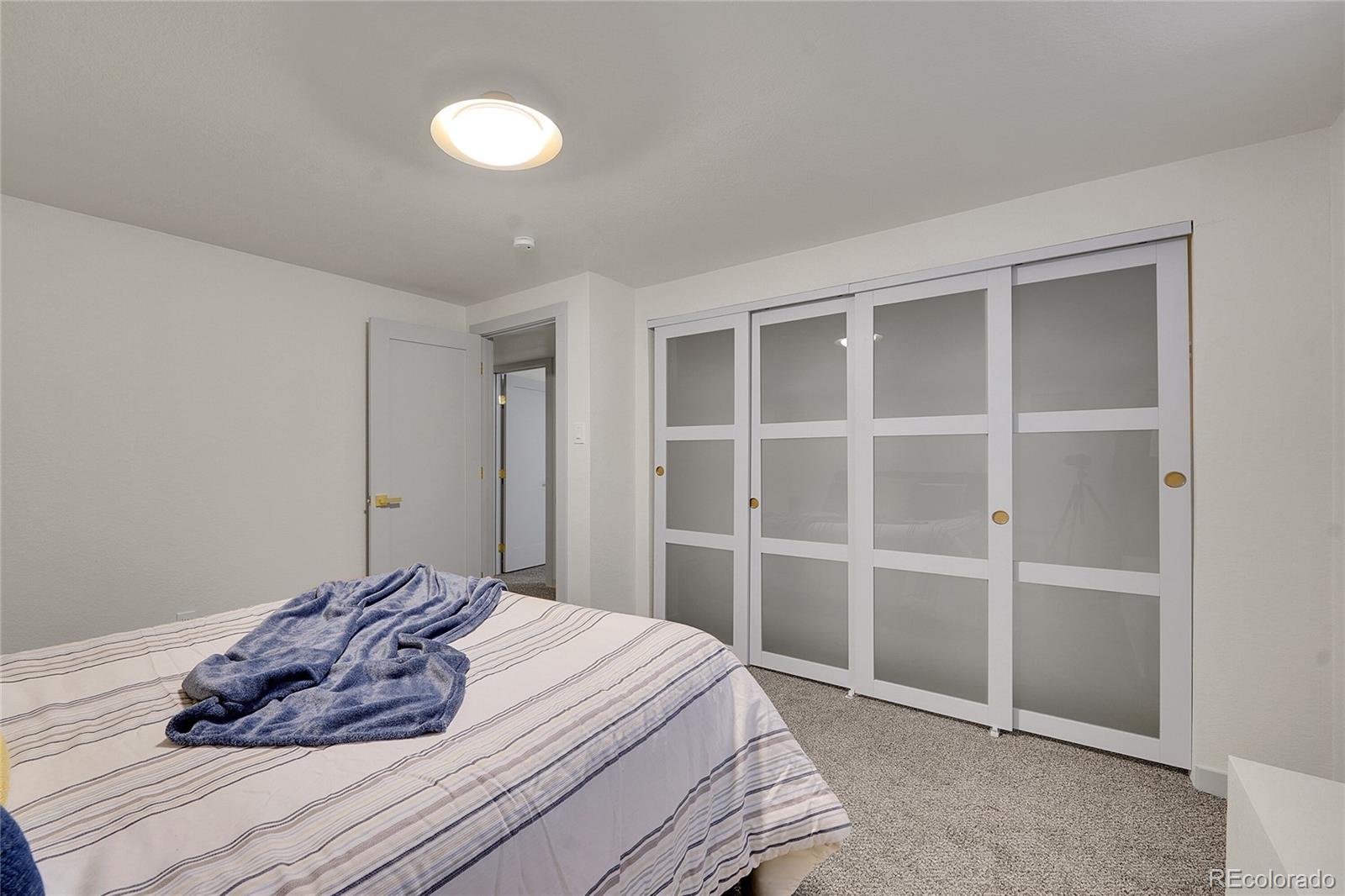 830 Welch Street Golden, CO 80401 - Photo 29 of 37 a bedroom with a bed and a cabinets