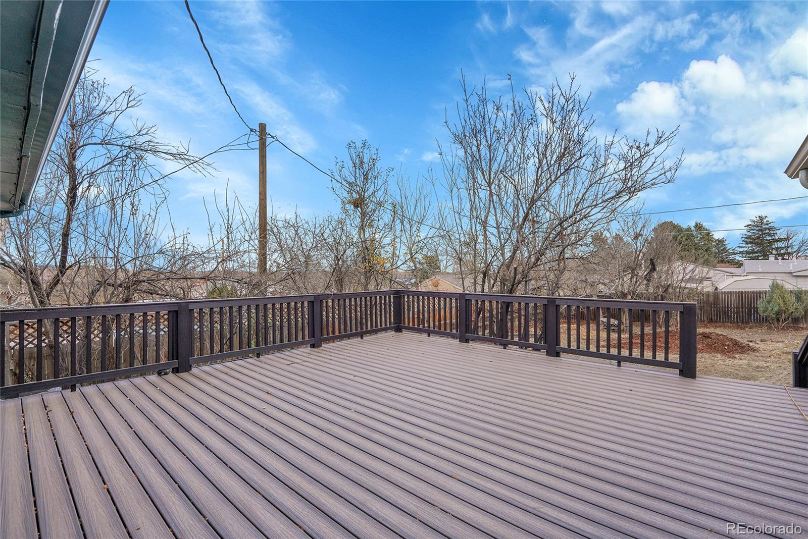 830 Welch Street Golden, CO 80401 - Photo 35 of 37 a view of balcony with wooden floor and fence