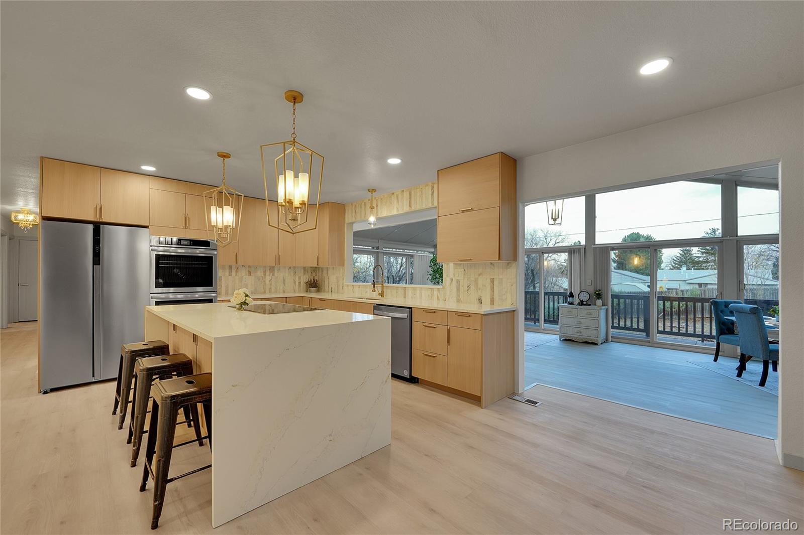 830 Welch Street Golden, CO 80401 - Photo 5 of 37 a large kitchen with a large window a counter space and stainless steel appliances