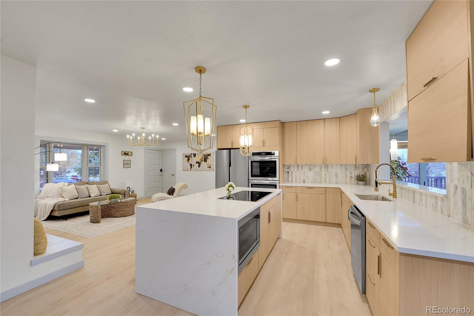 830 Welch Street Golden, CO 80401 - Photo 6 of 37 a large white kitchen with a large window and stainless steel appliances