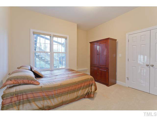 7613 Double E Court Raleigh, NC 27613 - Photo 13 of 23 Another great bedroom/bonus space located in the basement. Note the excellent view of the private back yard space! Bedroom