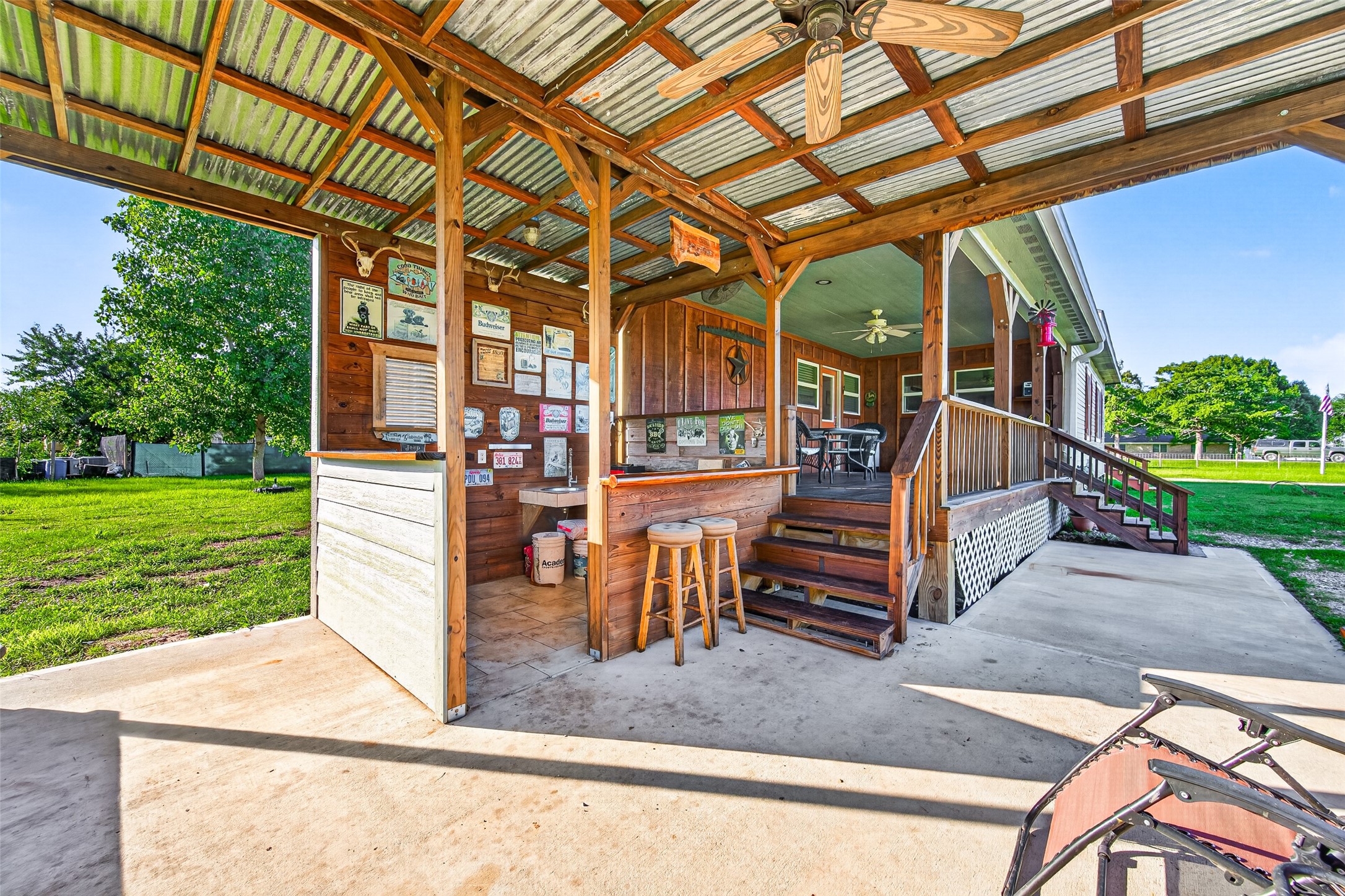 2240 Meyer Road Beasley, TX 77417 - Photo 22 of 29 Covered concrete patio and kitchen area is perfect for entertaining!