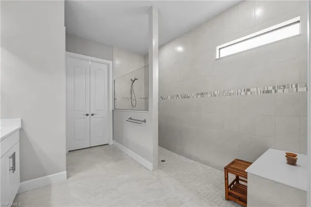 a bathroom with a shower and a sink