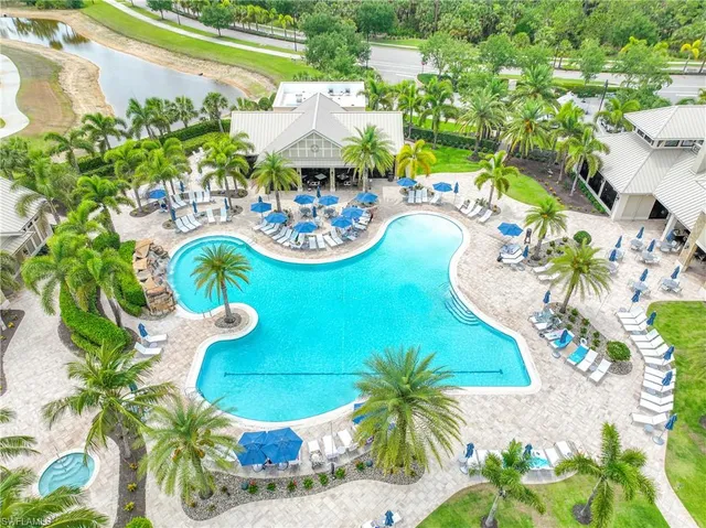 a view of swimming pool with a patio and a garden