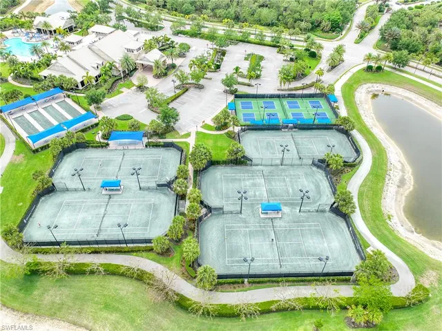 a living room with lots of furniture and a chandelier