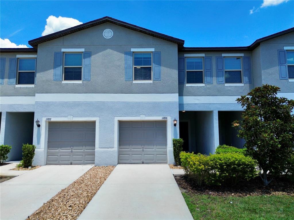 11826 Dumaine Valley Road Riverview, FL 33579 - Photo 1 of 54 a front view of a house with a yard and garage