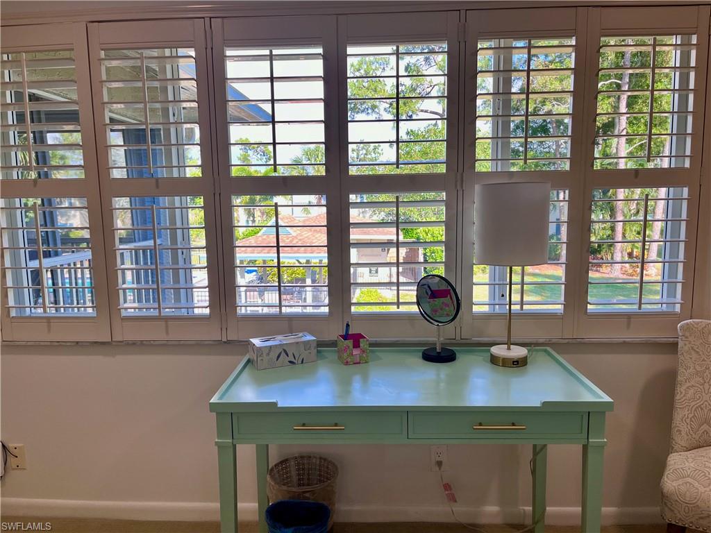 232 Memory Lane, Unit 4 Naples, FL 34112 - Photo 15 of 33 a kitchen with a sink and a window