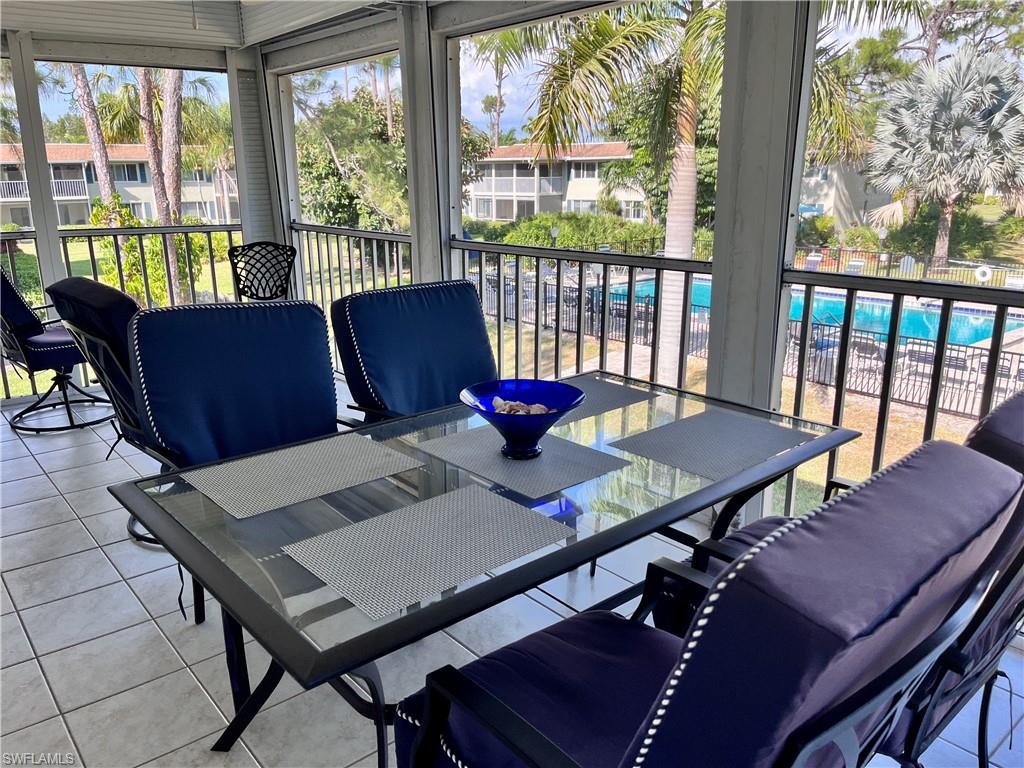 232 Memory Lane, Unit 4 Naples, FL 34112 - Photo 18 of 33 a view of a dining room with furniture window and outside view