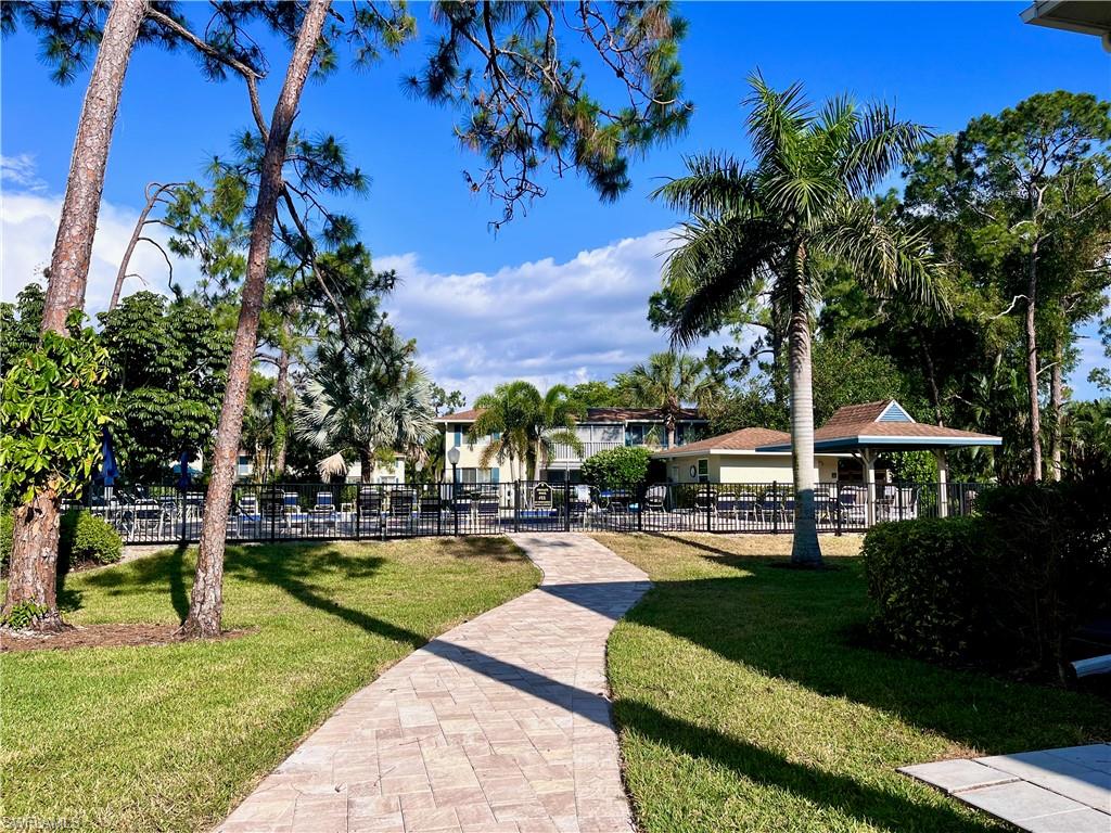232 Memory Lane, Unit 4 Naples, FL 34112 - Photo 21 of 33 a view of a park with plants and trees
