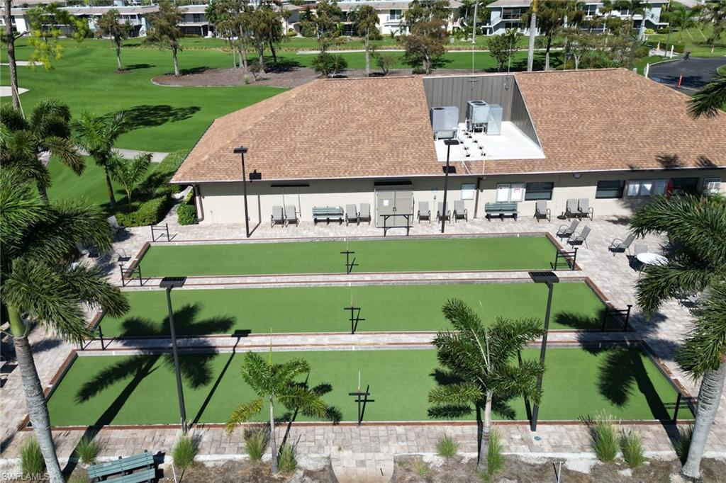 232 Memory Lane, Unit 4 Naples, FL 34112 - Photo 31 of 33 a view of a patio with table and chairs and potted plants