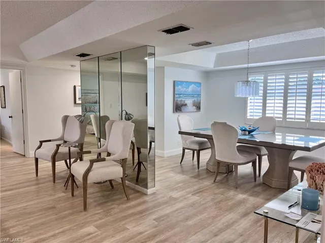 a view of a livingroom with furniture window and wooden floor