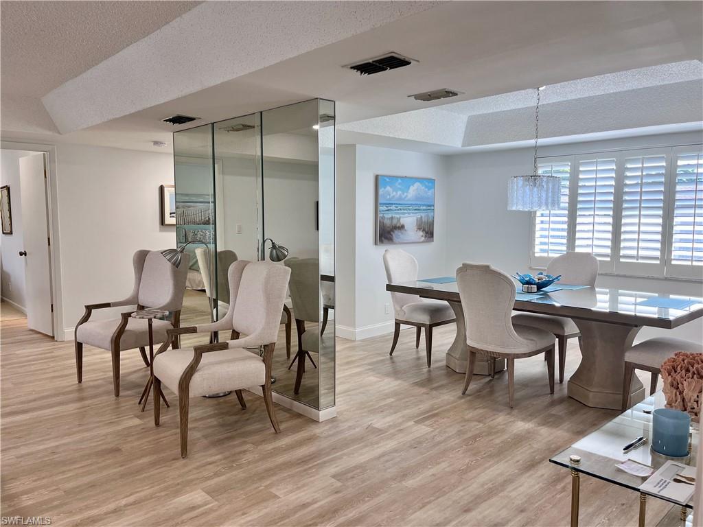 232 Memory Lane, Unit 4 Naples, FL 34112 - Photo 5 of 33 a view of a livingroom with furniture window and wooden floor
