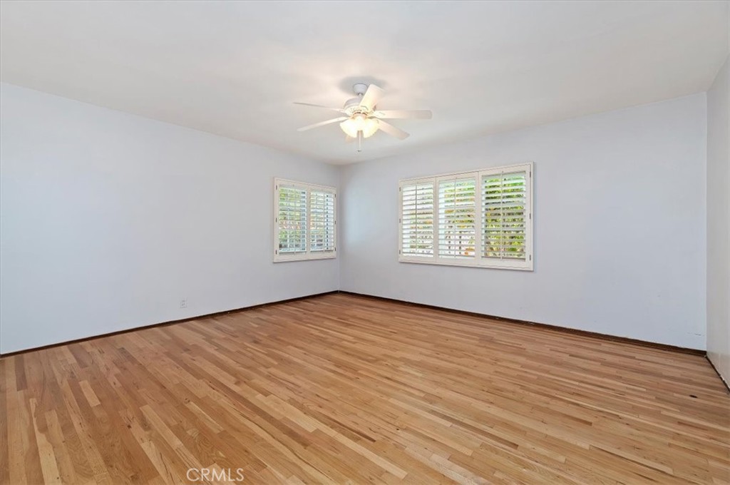 3630 Castle Reagh Place Riverside, CA 92506 - Photo 16 of 37 wooden floor in an empty room with a window