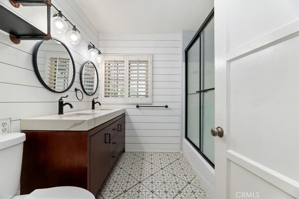3630 Castle Reagh Place Riverside, CA 92506 - Photo 19 of 37 a bathroom with a sink and a mirror