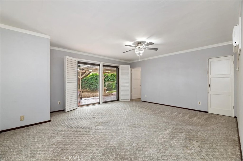 3630 Castle Reagh Place Riverside, CA 92506 - Photo 24 of 37 a view of a livingroom with an empty space and a ceiling fan