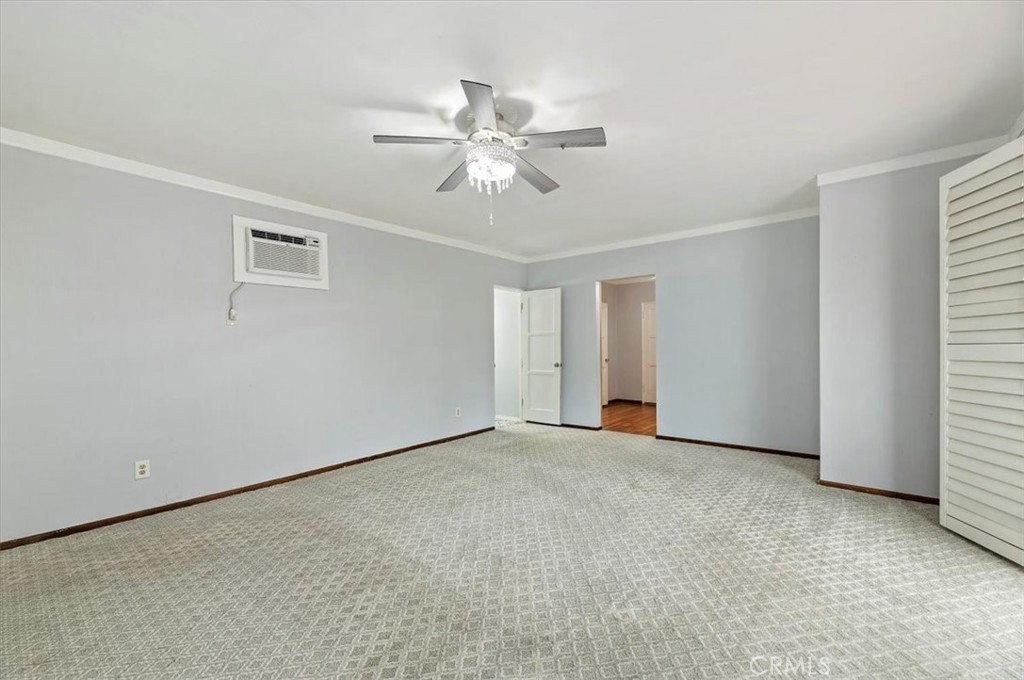 3630 Castle Reagh Place Riverside, CA 92506 - Photo 26 of 37 a view of an empty room with window and chandelier fan