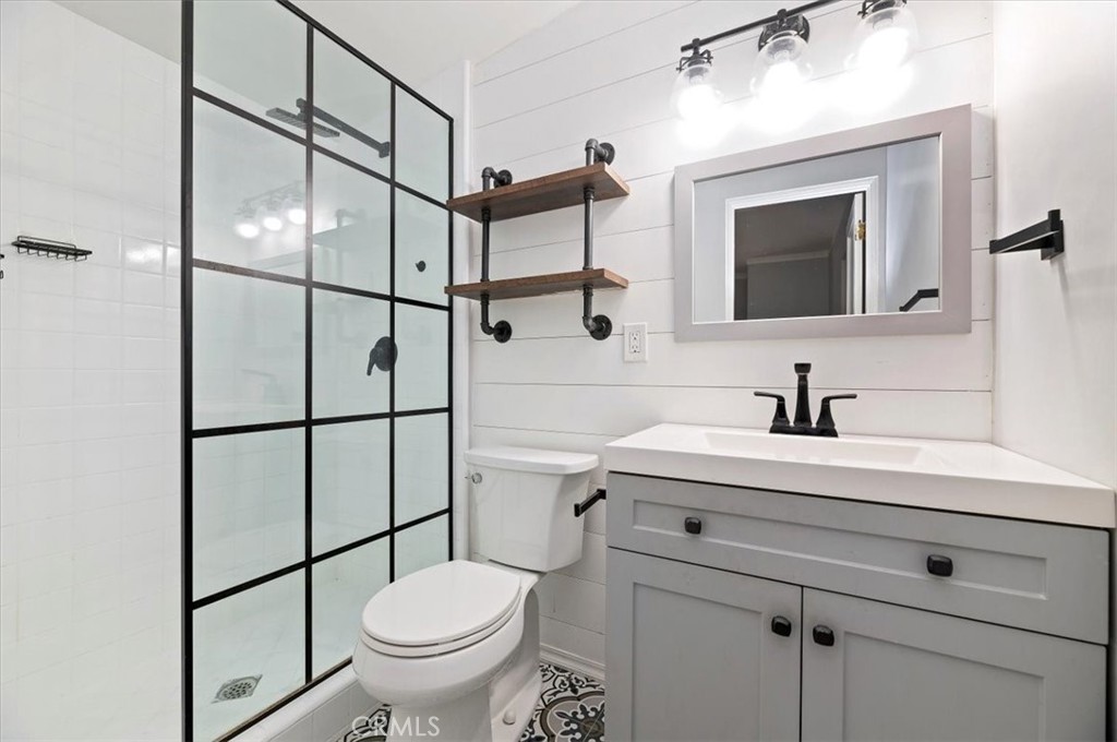 3630 Castle Reagh Place Riverside, CA 92506 - Photo 28 of 37 a bathroom with a sink toilet vanity and mirror