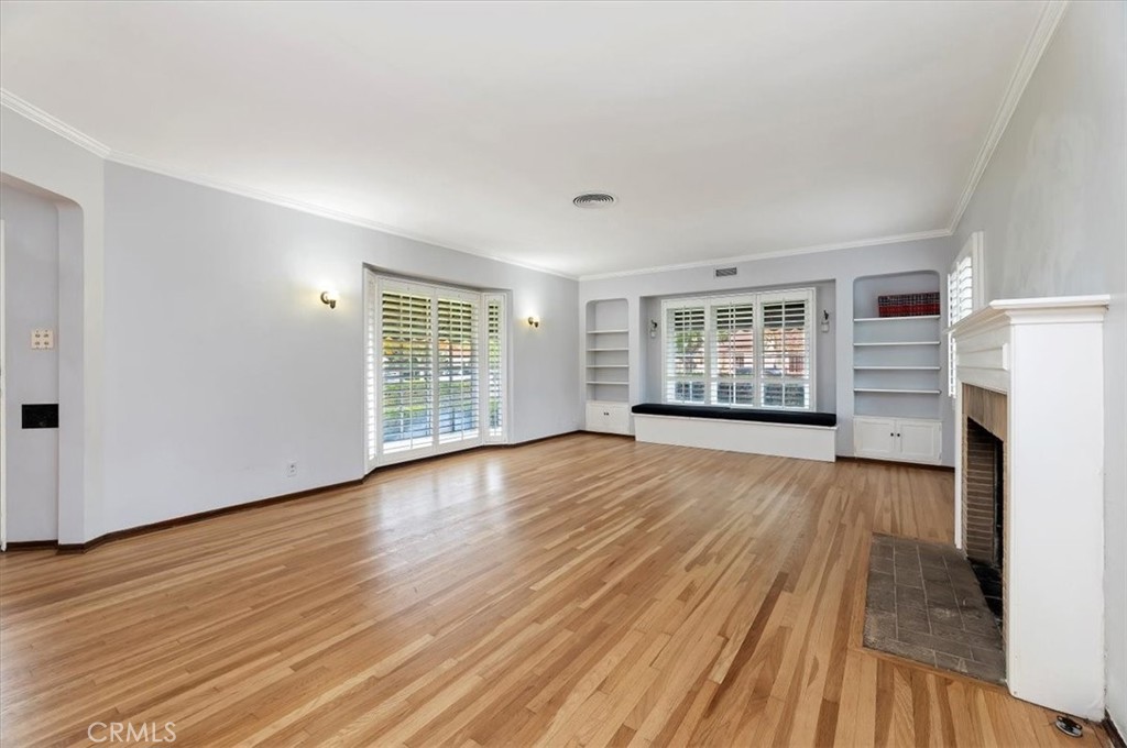 3630 Castle Reagh Place Riverside, CA 92506 - Photo 4 of 37 a view of empty room with wooden floor and fireplace