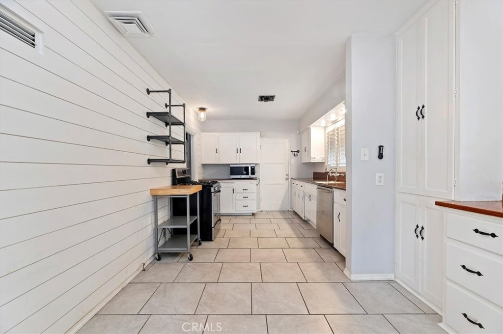 3630 Castle Reagh Place Riverside, CA 92506 - Photo 9 of 37 a kitchen with a sink and cabinets