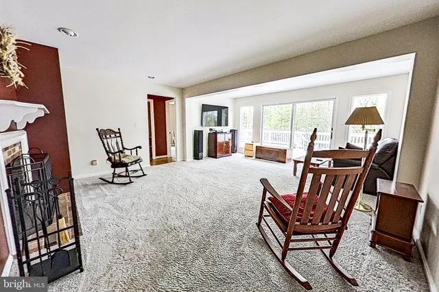 a view of a livingroom with furniture and a window