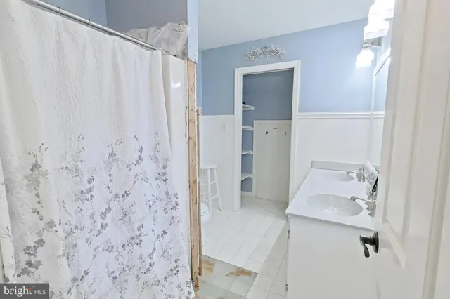 a bathroom with a sink and mirror