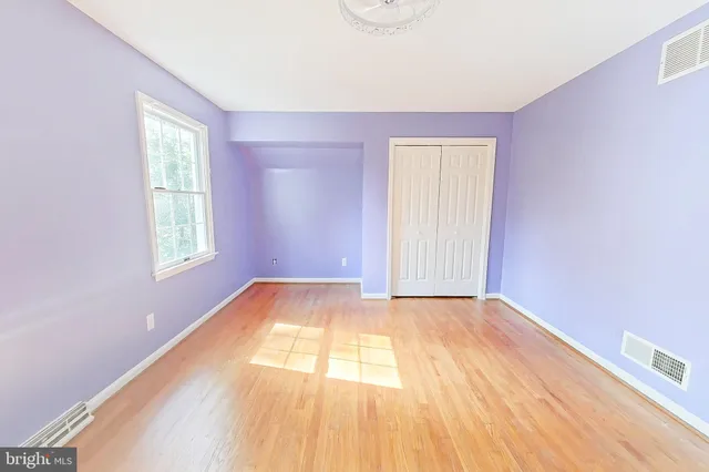 a view of an empty room with stairs