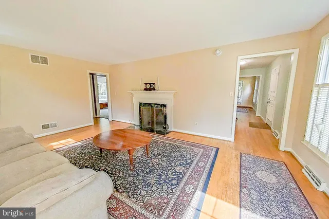 a bedroom with a bed and a fireplace