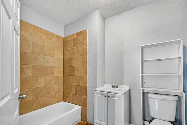 a bathroom with a bathtub and a shower