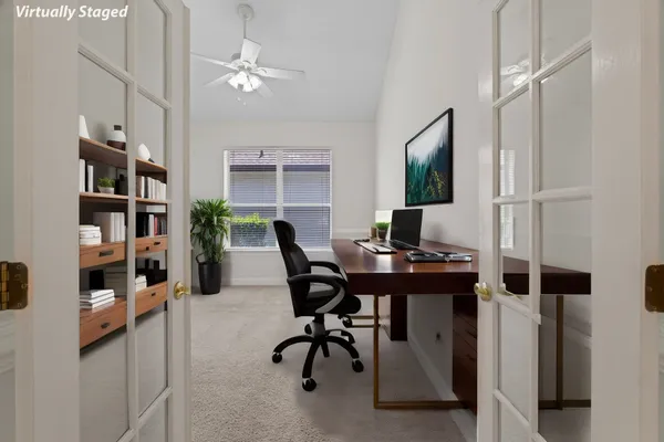 a view of a workspace with furniture