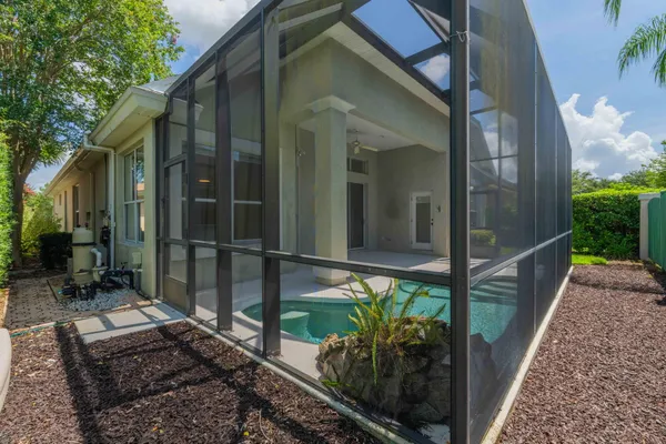 a view of a house with a yard and plants