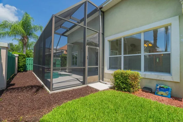 an aerial view of multiple houses with a yard
