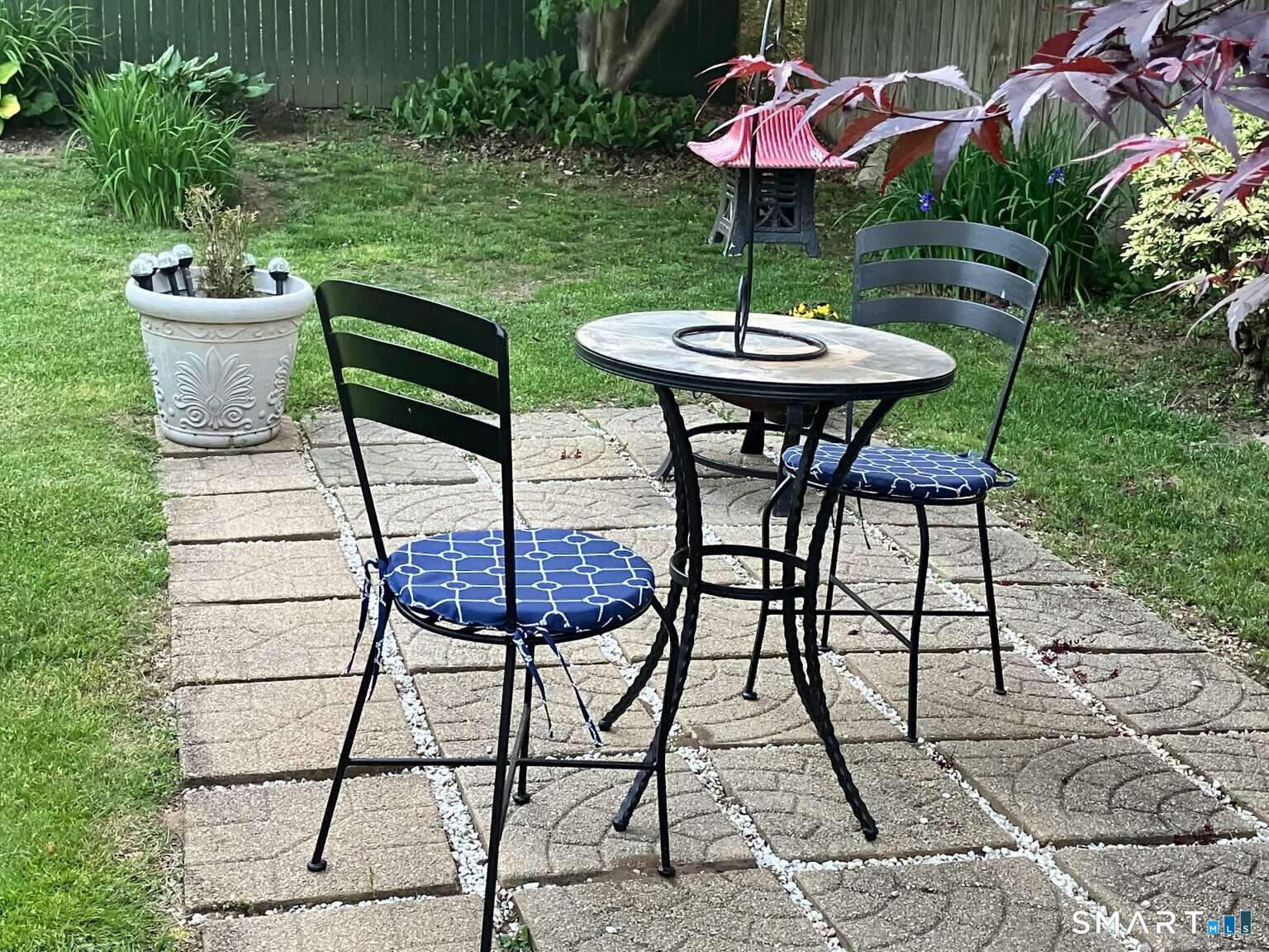294 Church Street Guilford, CT 06437 - Photo 13 of 32 a view of a backyard with furniture and a garden