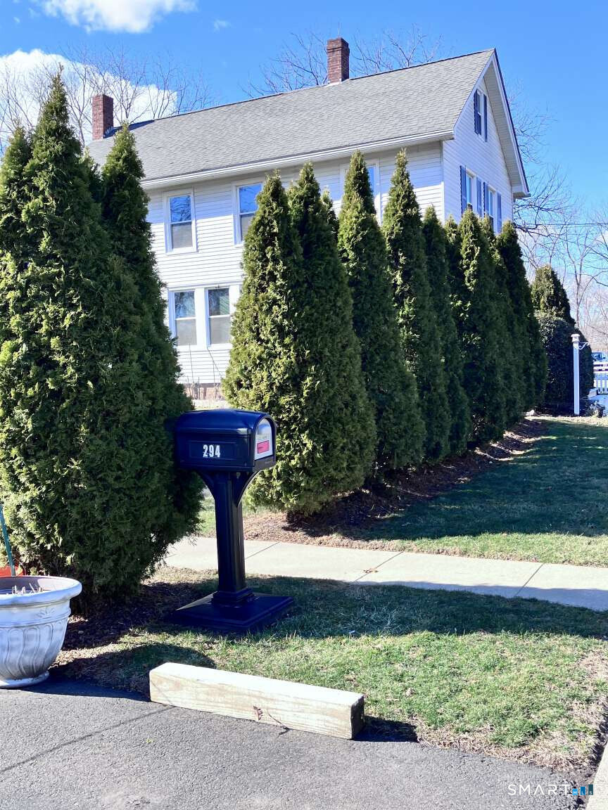 294 Church Street Guilford, CT 06437 - Photo 16 of 32 a front view of a house with garden