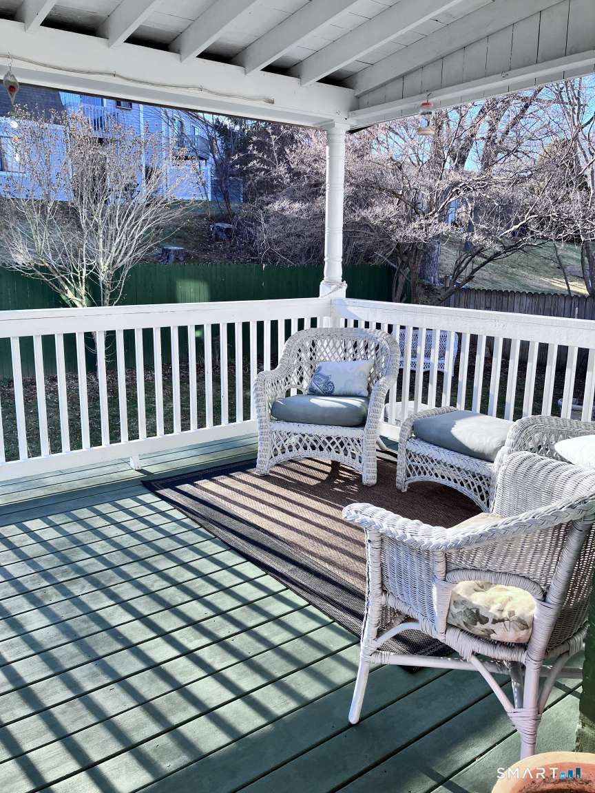 294 Church Street Guilford, CT 06437 - Photo 17 of 32 a view of a chair in wooden deck