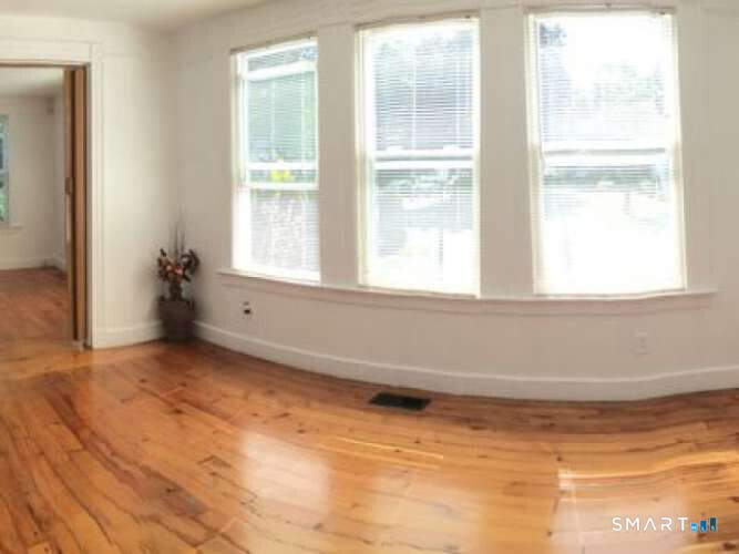 294 Church Street Guilford, CT 06437 - Photo 20 of 32 a view of an empty room with a window