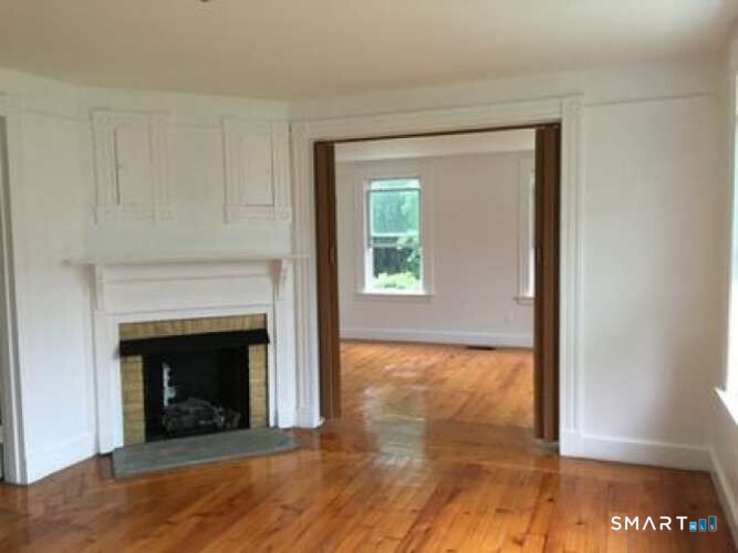 294 Church Street Guilford, CT 06437 - Photo 21 of 32 a view of an empty room with glass door and wooden floor