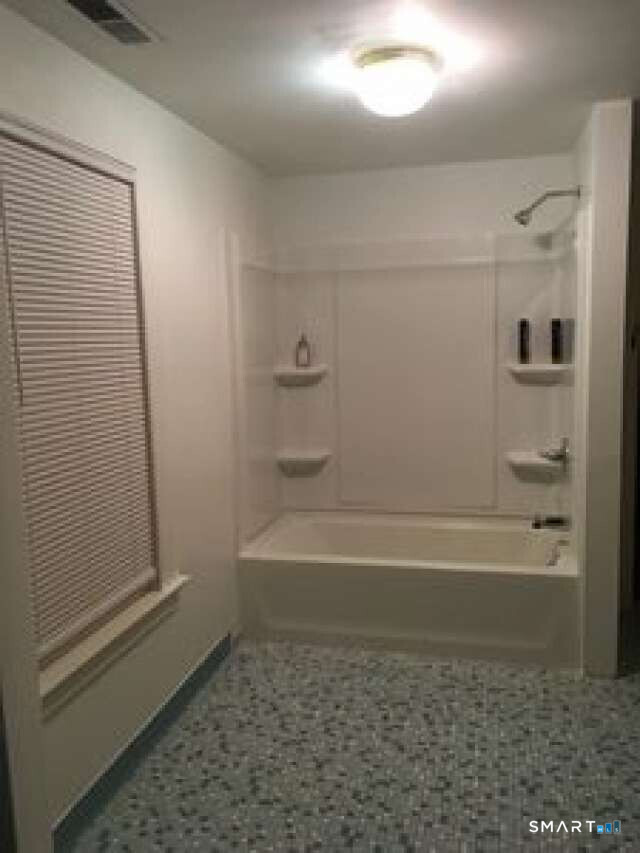 294 Church Street Guilford, CT 06437 - Photo 27 of 32 a bathroom with bathtub and shower