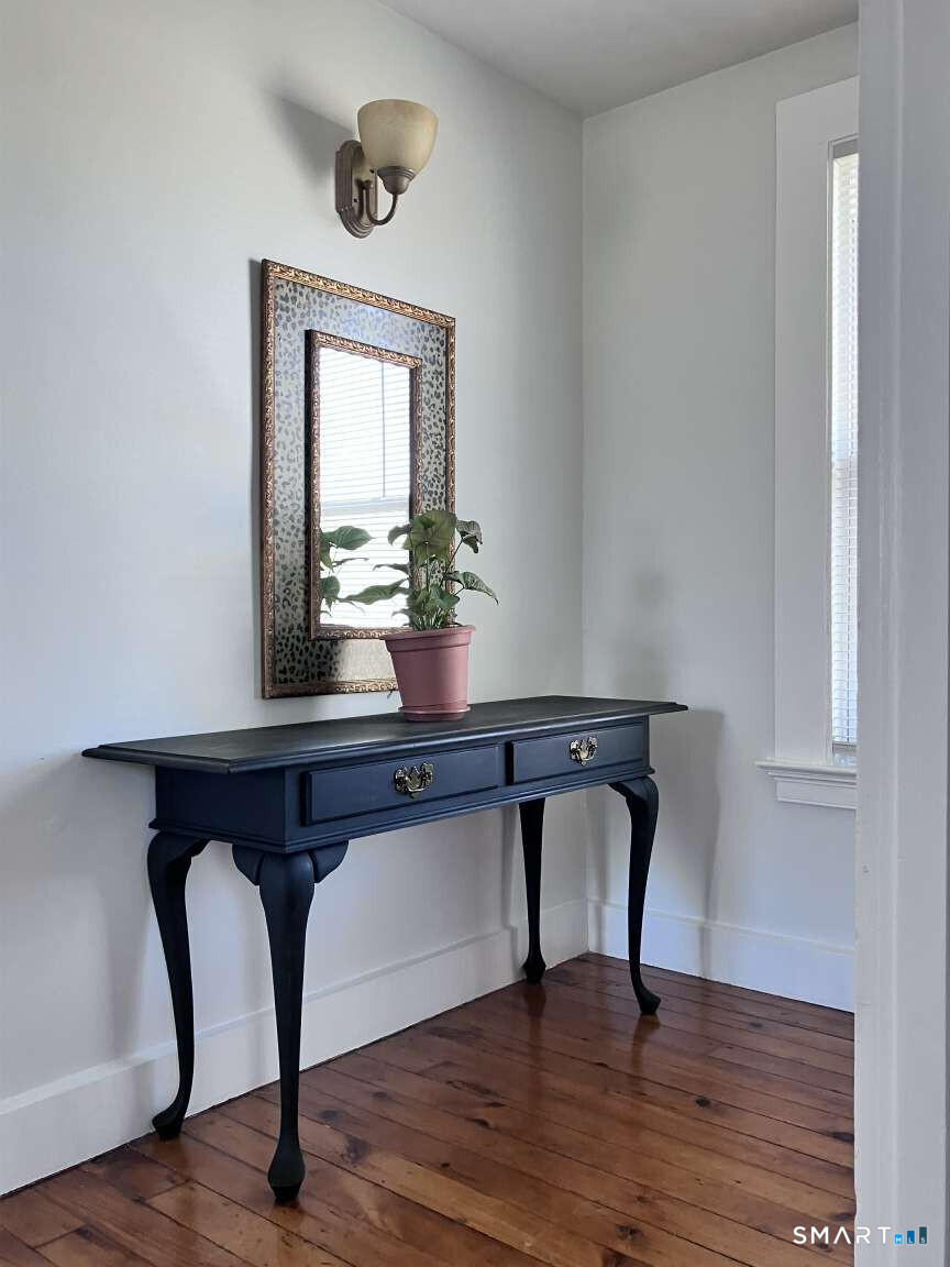 294 Church Street Guilford, CT 06437 - Photo 28 of 32 a view of a chair and table in a room