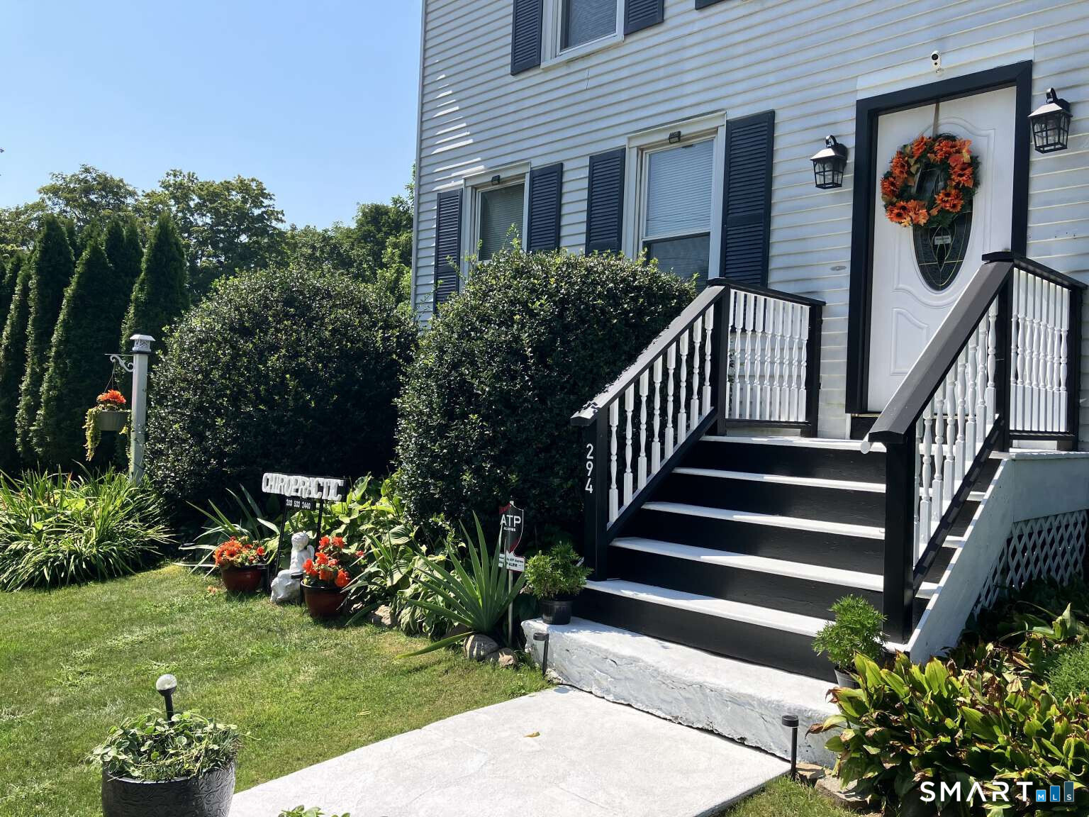 294 Church Street Guilford, CT 06437 - Photo 3 of 32 a view of a house with backyard and garden